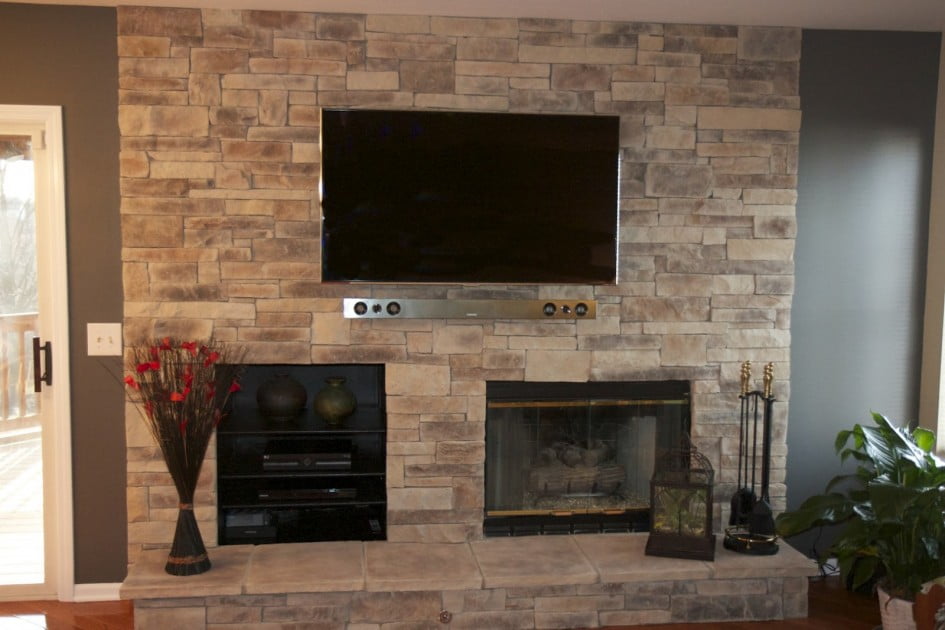 Charming-Living-Room-Design-with-Rustic-Stone-Wall-Fireplace-Contemporary-Wall-Mounted-TV-Ideas-945x630