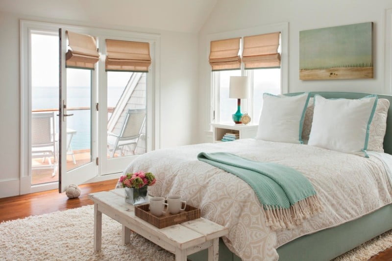 Blue-And-Green-beach-side-Beachside-Bedroom-beige-shades-blue-blue-bedframe-blue-fabric-bed-breezy-coastal-decor-coastal-home-cream-deck-ethereal-fresh-glazed-ceramic-lamp-hard-wood-hardwood-li