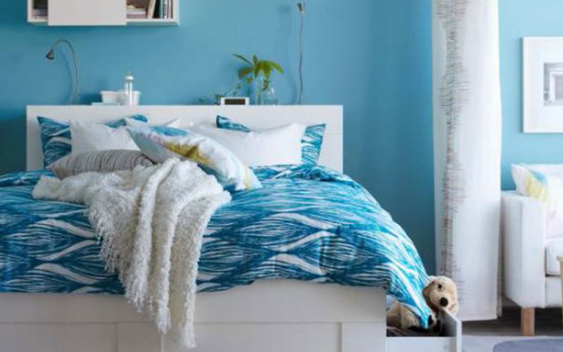 interior-blue-bedsheet-also-having-drawer-in-the-blue-wall-color-cool-furniture-for-teens-to-beautify-your-room-ideas-mesmerezing-cool-furniture-for-teens-by-white-wooden-bed-945x591